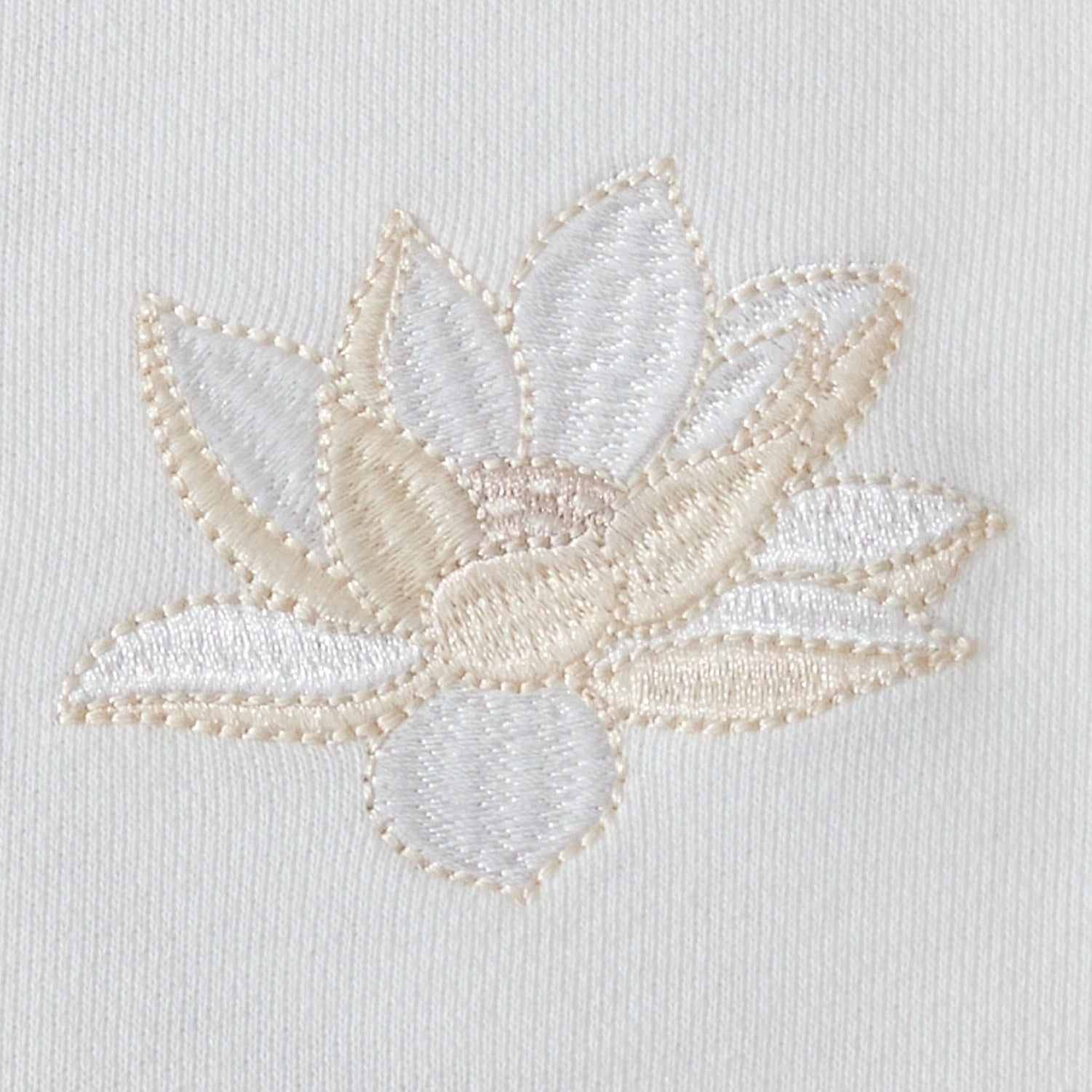 Close-up of the lotus flower Lotus flower chest embroidery on the white sweatshirt with neat satin stitching