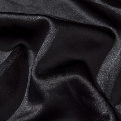 Smooth, lustrous satin fabric texture