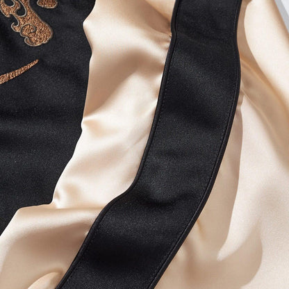 Satin sleeve panel detail with black side stripe and smooth luster