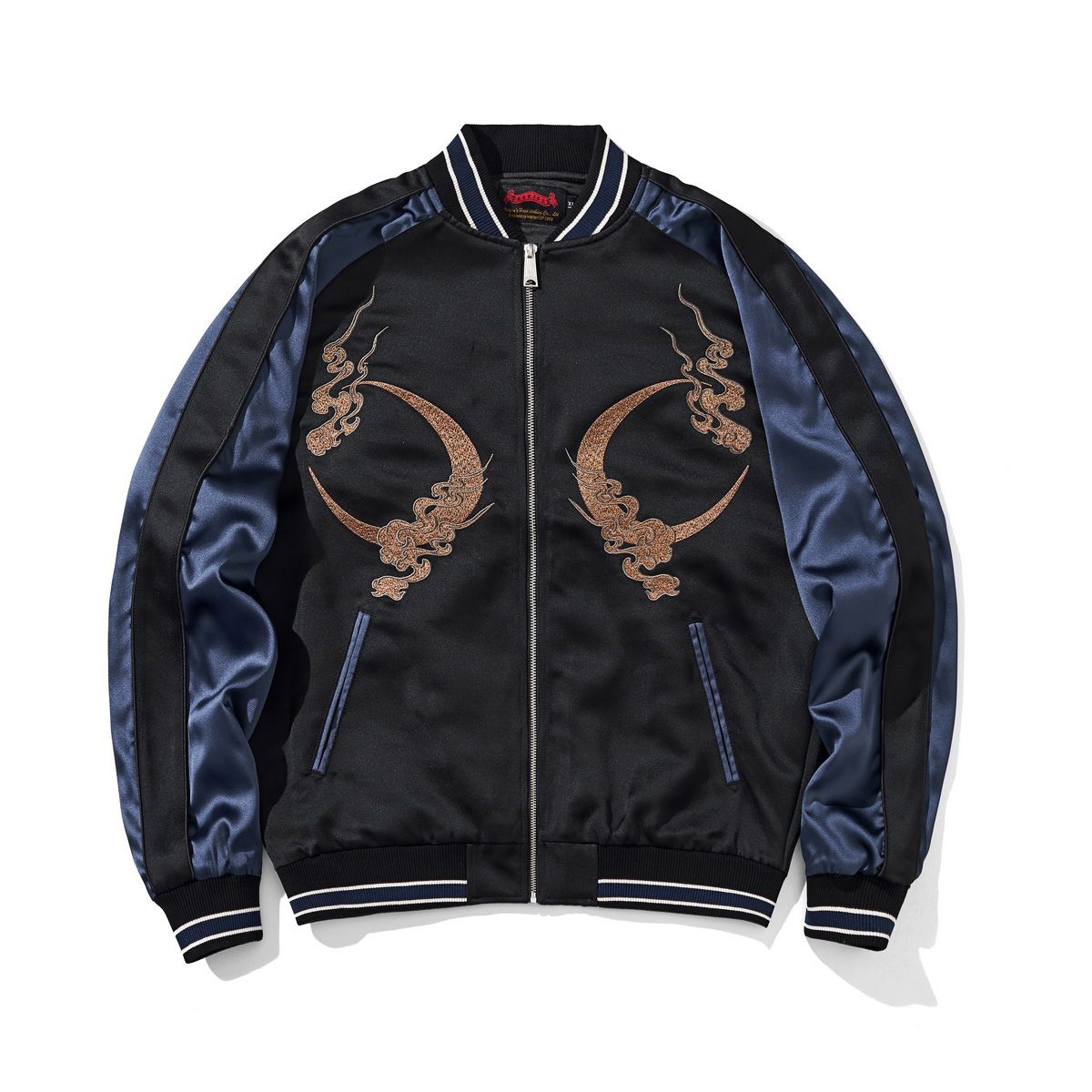 Front view in navy with paired crescent-moon embroidery and contrast ribbed trims