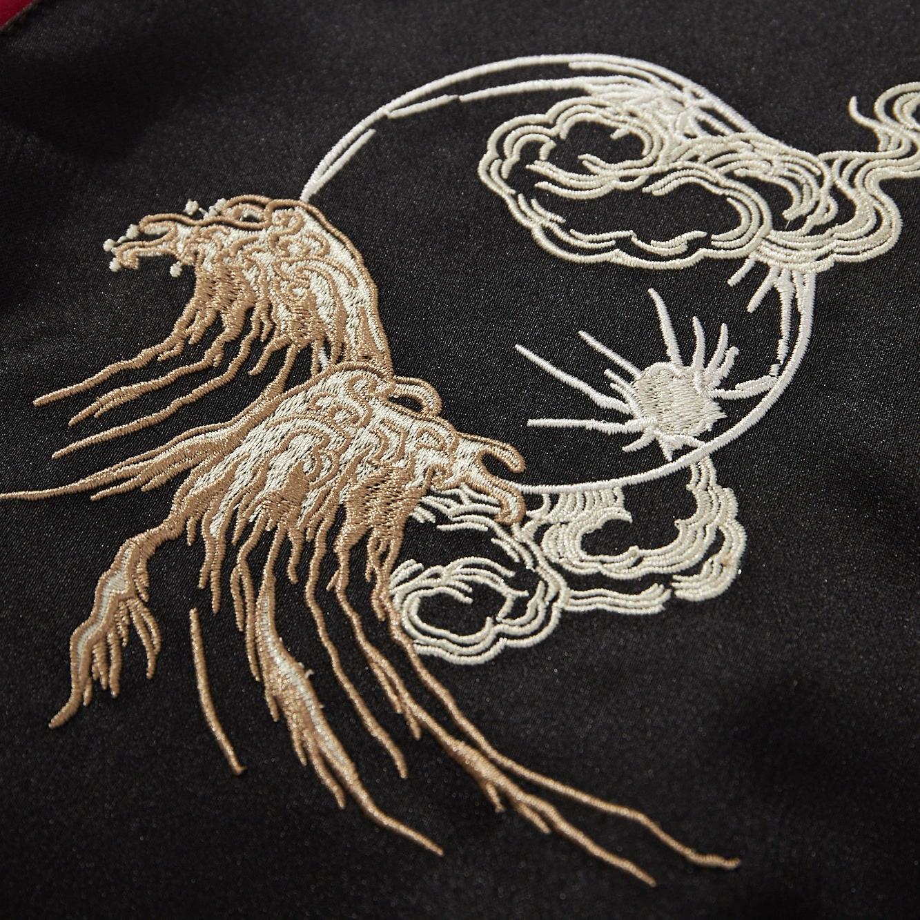 Chest crest detail with moon, clouds, and waves