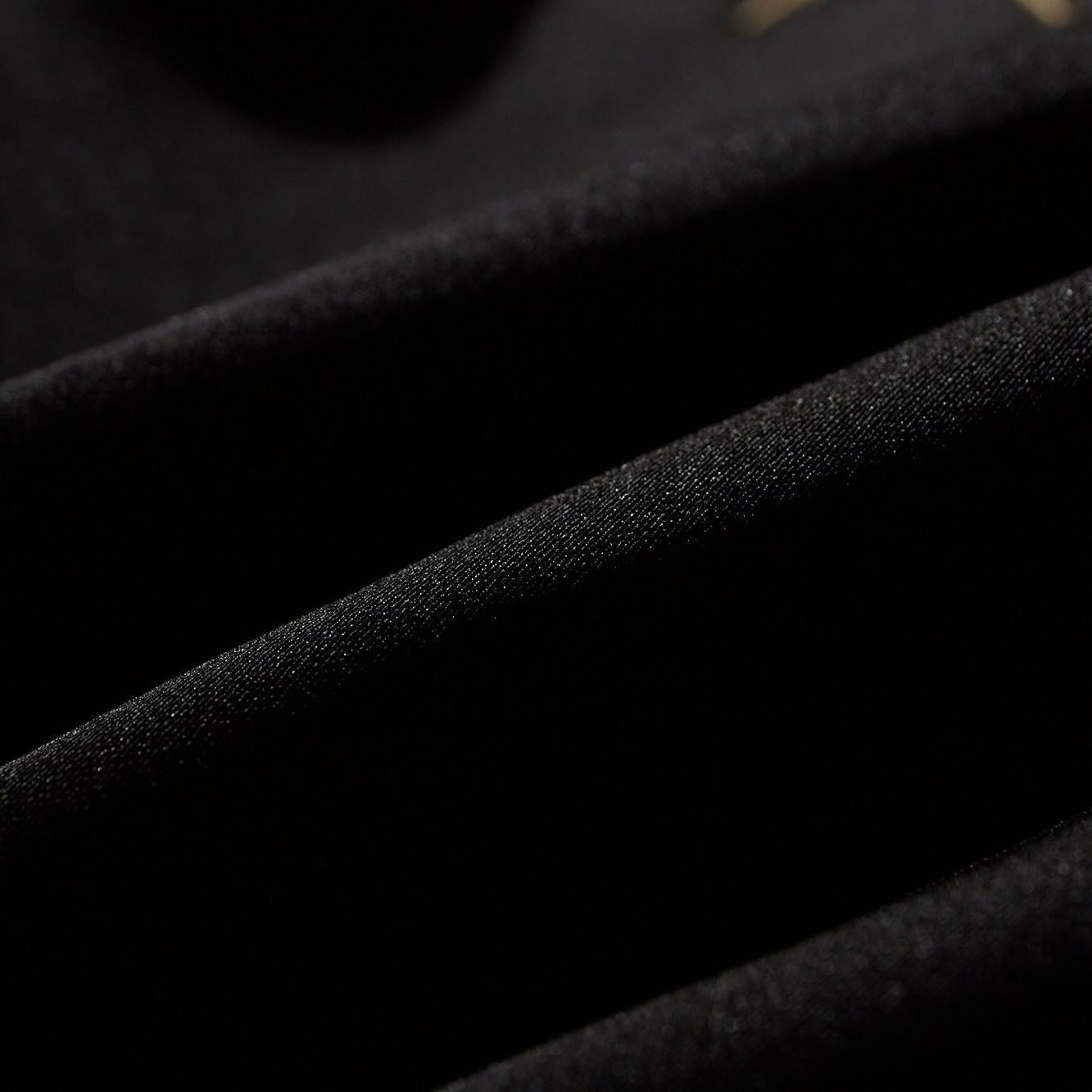 Close-up of satin twill fabric with a smooth, subtle sheen and tight weave