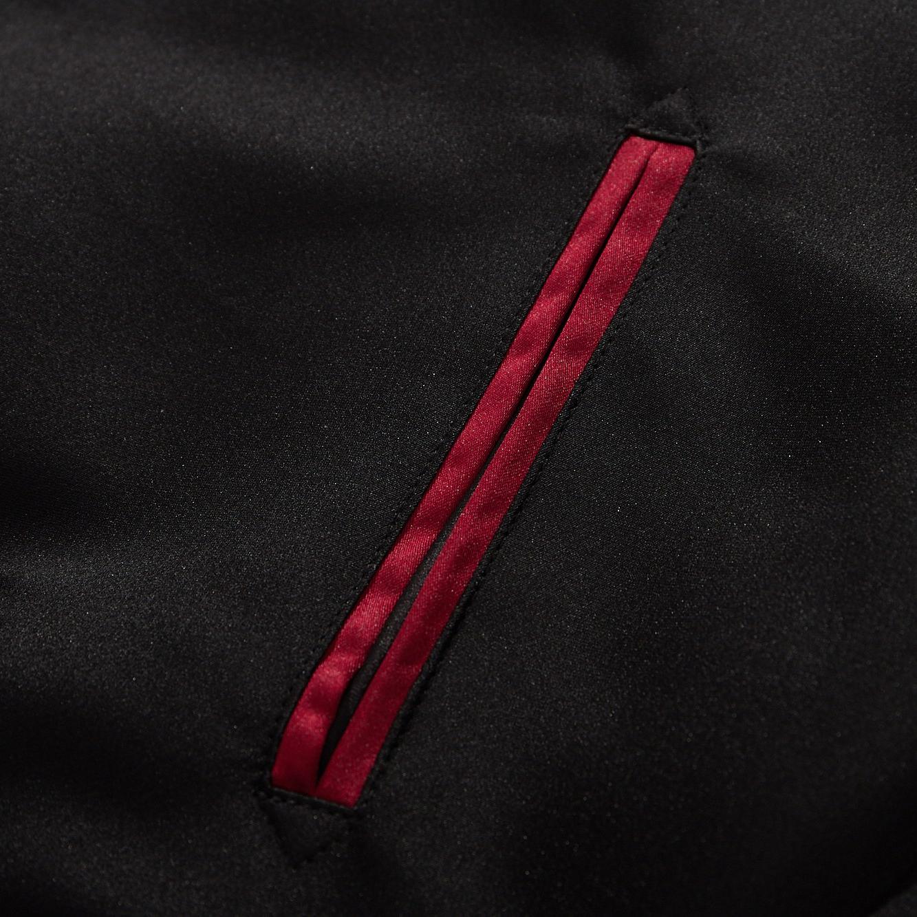 Welt pocket detail with red satin piping