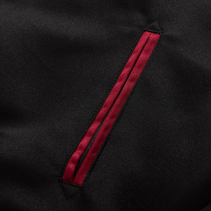 Welt pocket detail with red satin piping