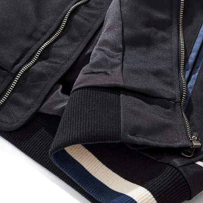 Hem and rib knit detail at the bottom opening beside the zipper