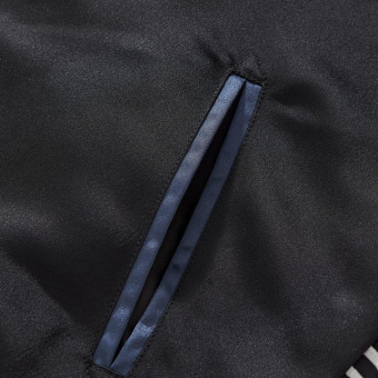Welt pocket detail on the body panel with neat stitching