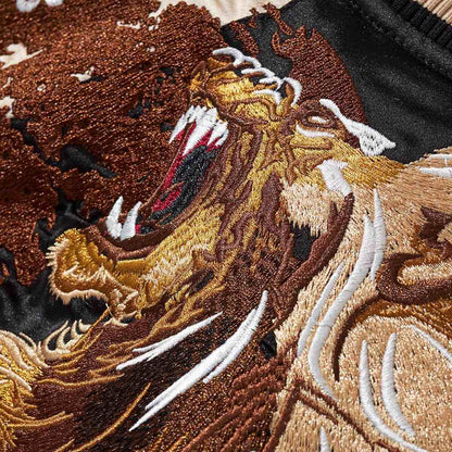 Beige color sukajan jacket close-up of roaring lion head with dense layered stitching.