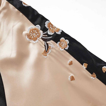 Beige color sukajan jacket sleeve detail with sakura blossom embroidery along the contrast stripe.