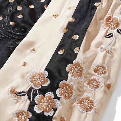 Beige color sukajan jacket sleeve panel with scattered sakura petals and contrast bands.
