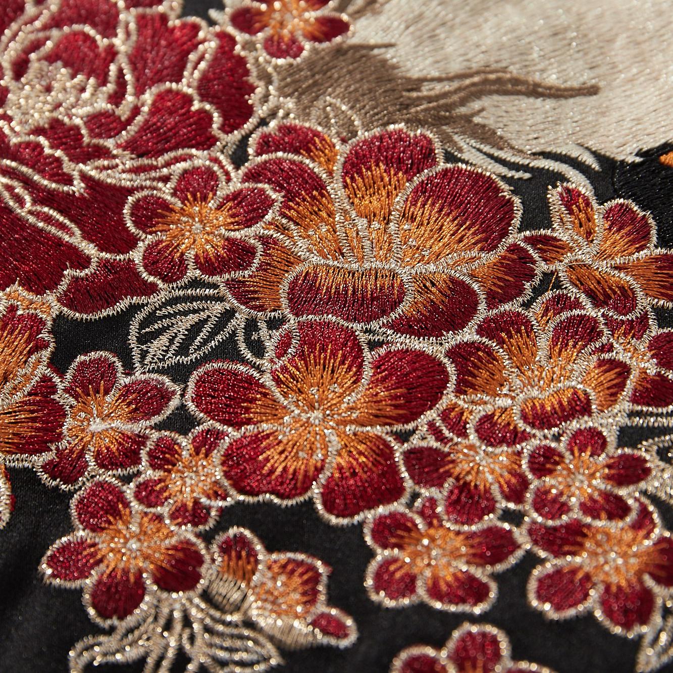 Peony blossom embroidery with rich thread shading close-up
