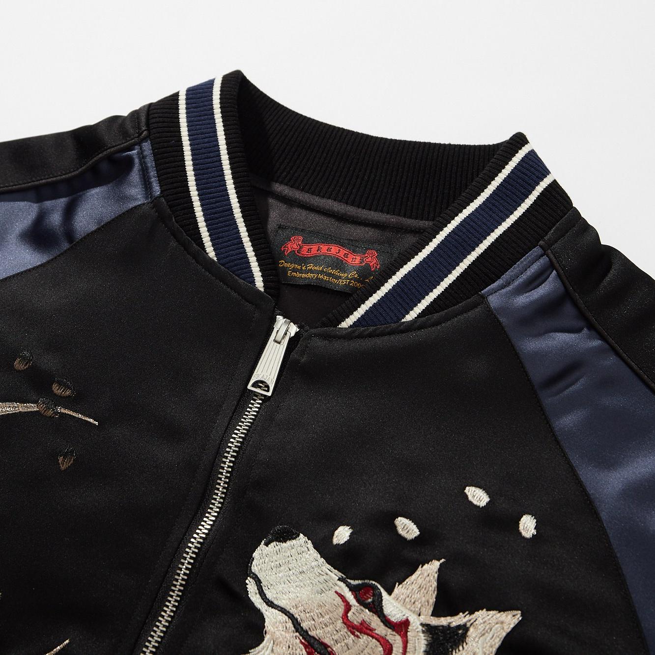 Ribbed collar with twin stripes; smooth satin raglan shoulders