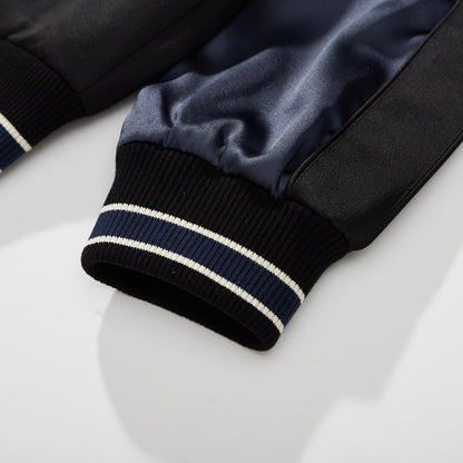 Ribbed cuff detail with navy-white stripe