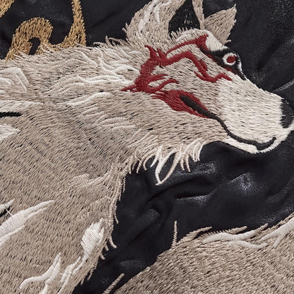 Macro shot of the Nine-Tailed Fox embroidery showing detailed fur texture and red facial markings.