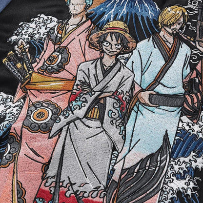 Close-up of kimono trio embroidery with wave outlines