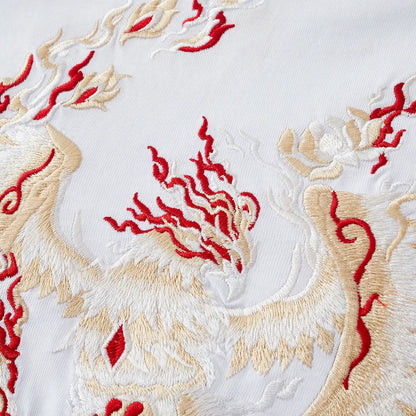 Macro shot showing the high-density thread texture of the spirit flames and Phoenix feathers.