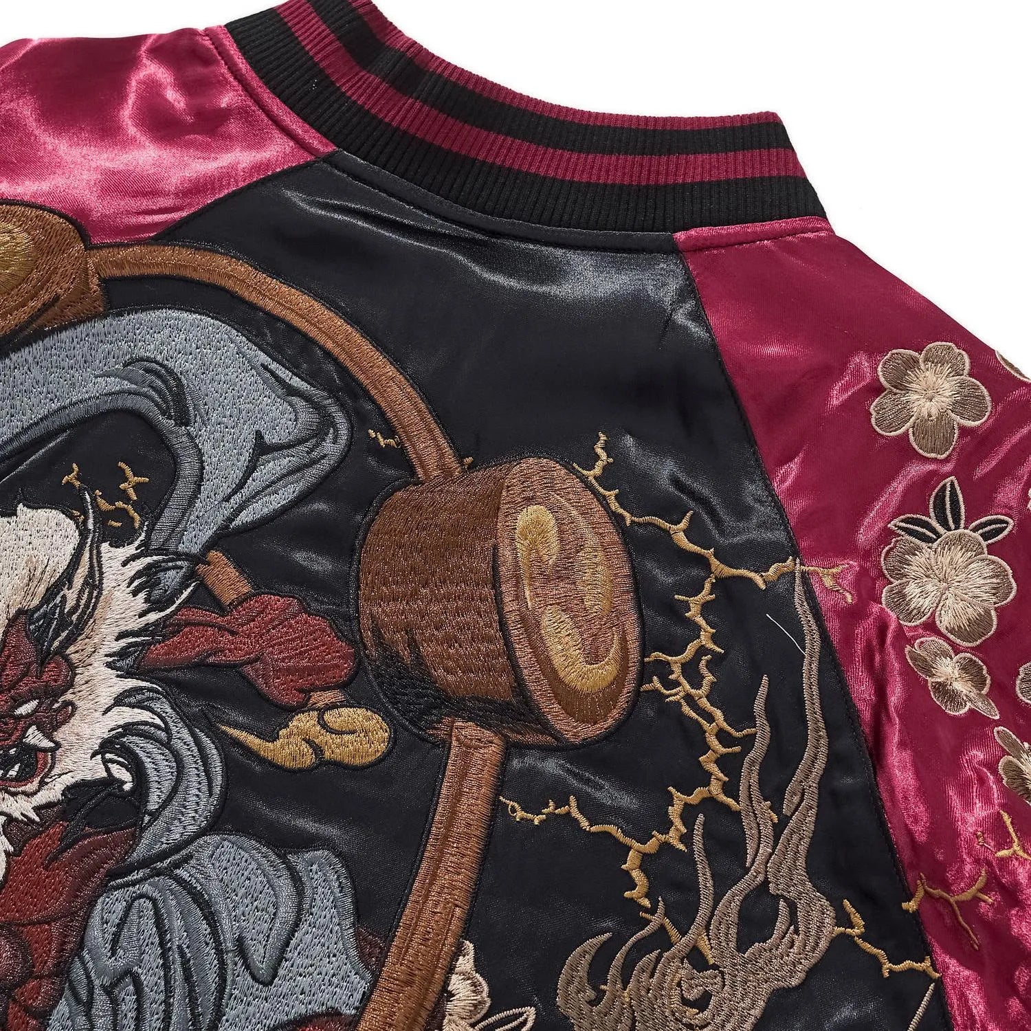 Back shoulder view showing the connection between the ribbed collar and the Thunder God's drums.