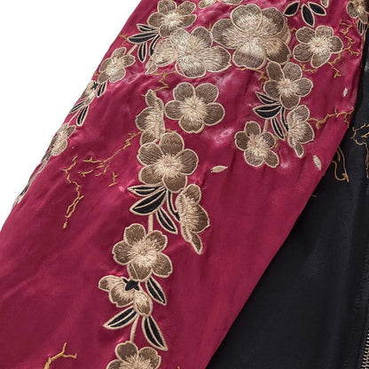 Close-up of the detailed Sakura (Cherry Blossom) embroidery on the burgundy rayon sleeve.