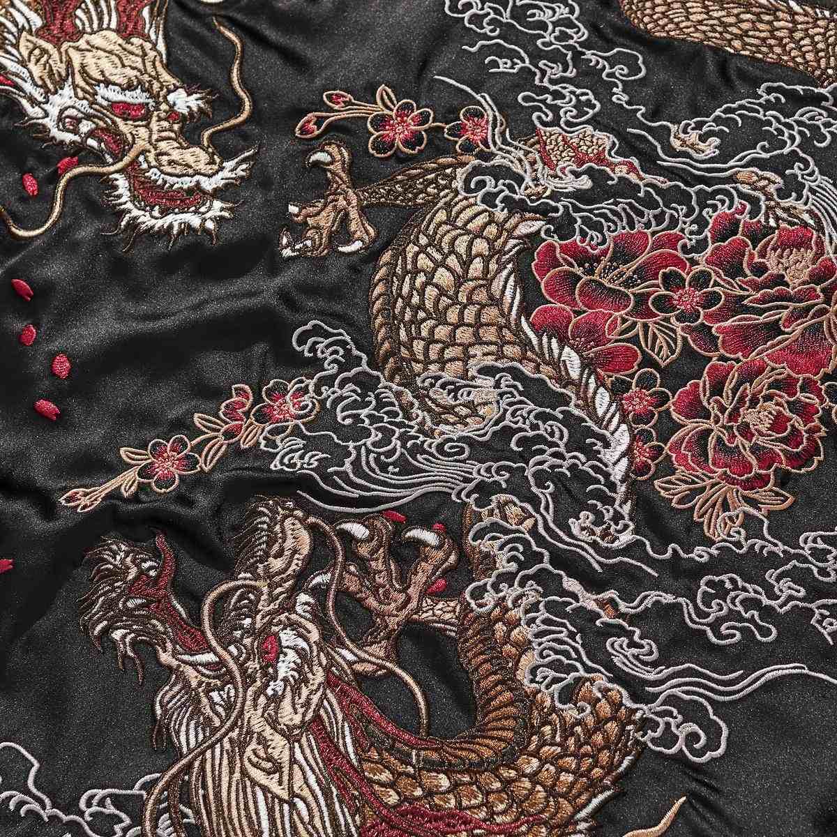 Close-up—coiling dragon body with peony blossoms and cloud plumes.