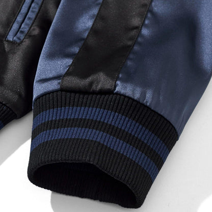 Ribbed cuff detail with striped bands on the sleeve
