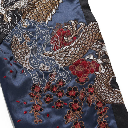 Dragon and peony embroidery detail on a satin panel