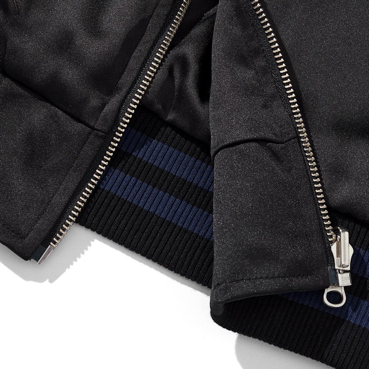 Hem and zipper guard detail with striped rib
