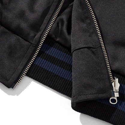 Hem and zipper guard detail with striped rib