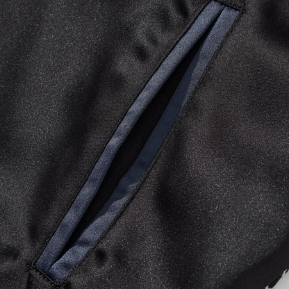 Slanted welt pocket close-up with clean stitching