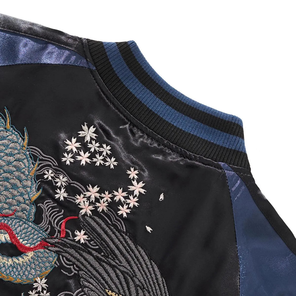 Detail of the raglan sleeve shoulder construction on the reverse main side.