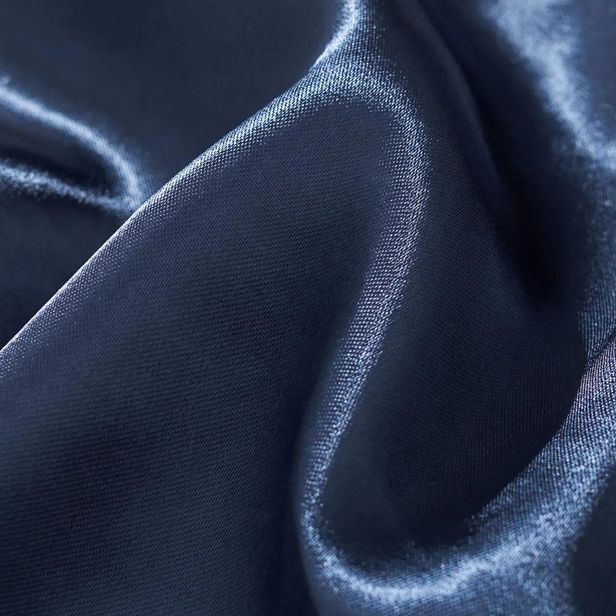 Macro shot showing the smooth texture of the blue rayon satin fabric.