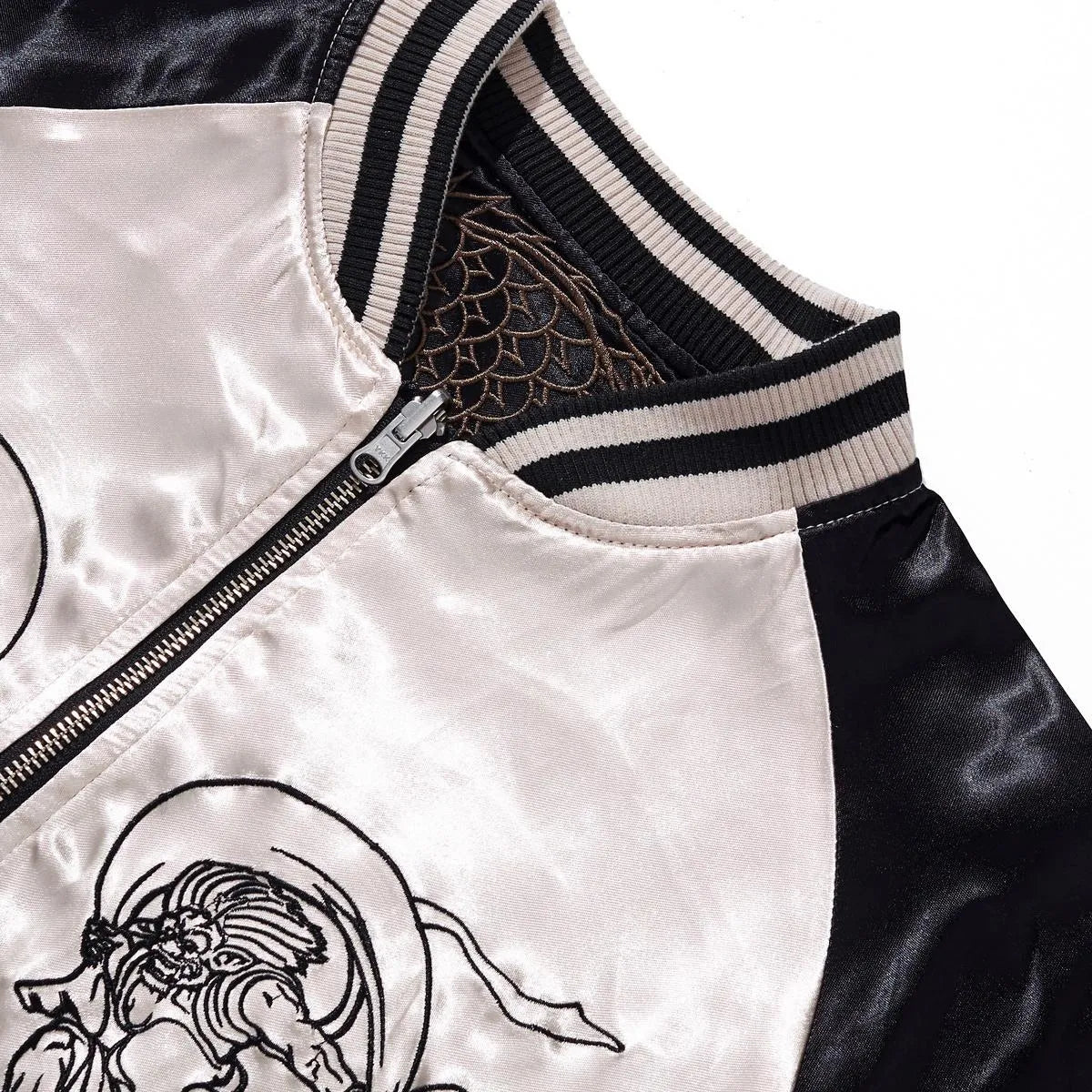 Close-up of the vintage ribbed collar and premium metal zipper on the reversible side.