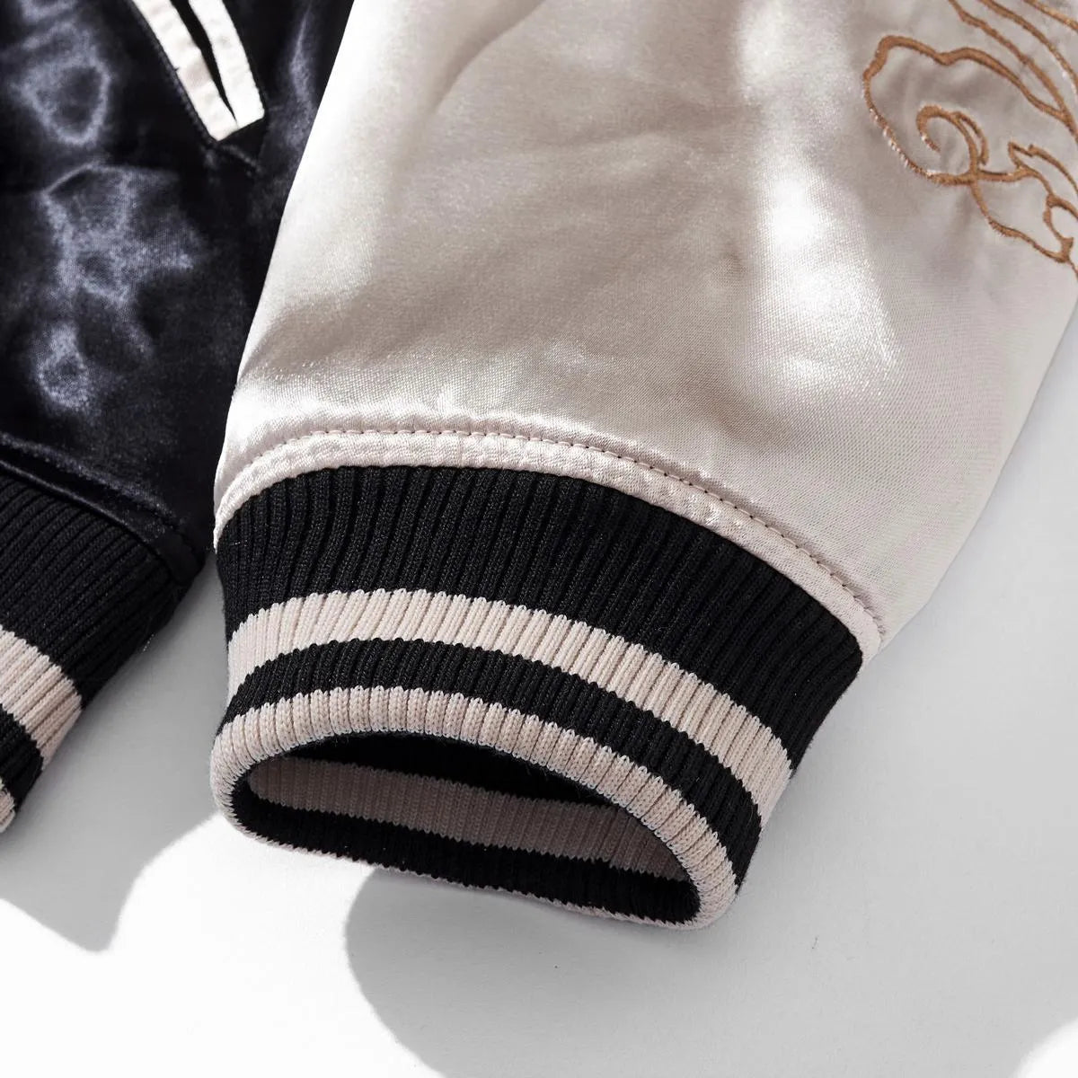 Detail of the elastic ribbed sleeve cuff ensuring a comfortable bomber fit.