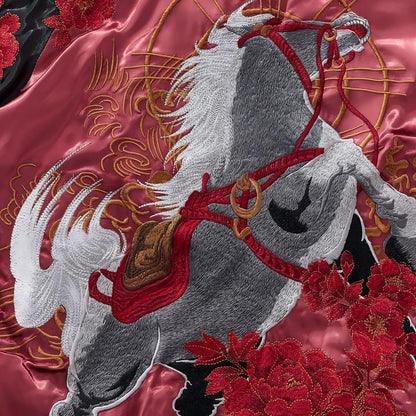 Macro shot of the embroidery texture showing the horse's saddle and musculature.