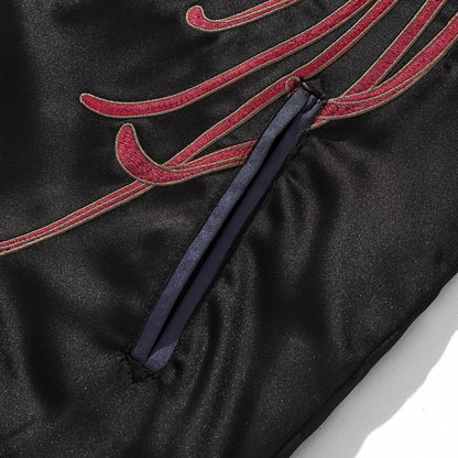 Front welt pocket with blue piping and flowing red chrysanthemum petals