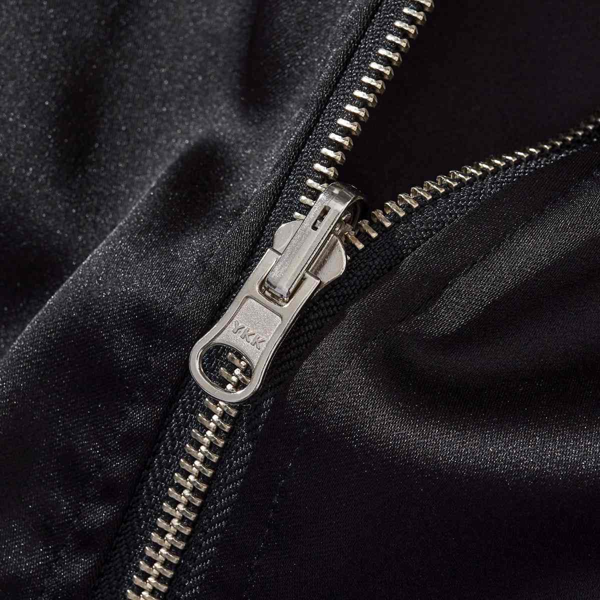 YKK metal zipper close-up on the reversible Lion & Sakura sukajan jacket for a smooth, durable closure.