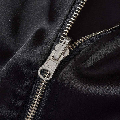 YKK metal zipper close-up on the reversible Lion & Sakura sukajan jacket for a smooth, durable closure.