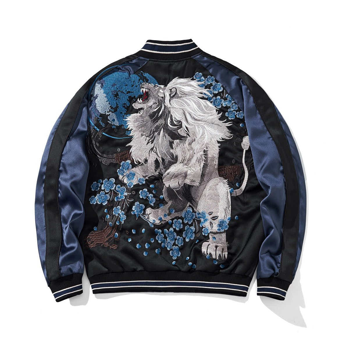 Back view featuring a roaring lion amid blue blossoms under a full moon