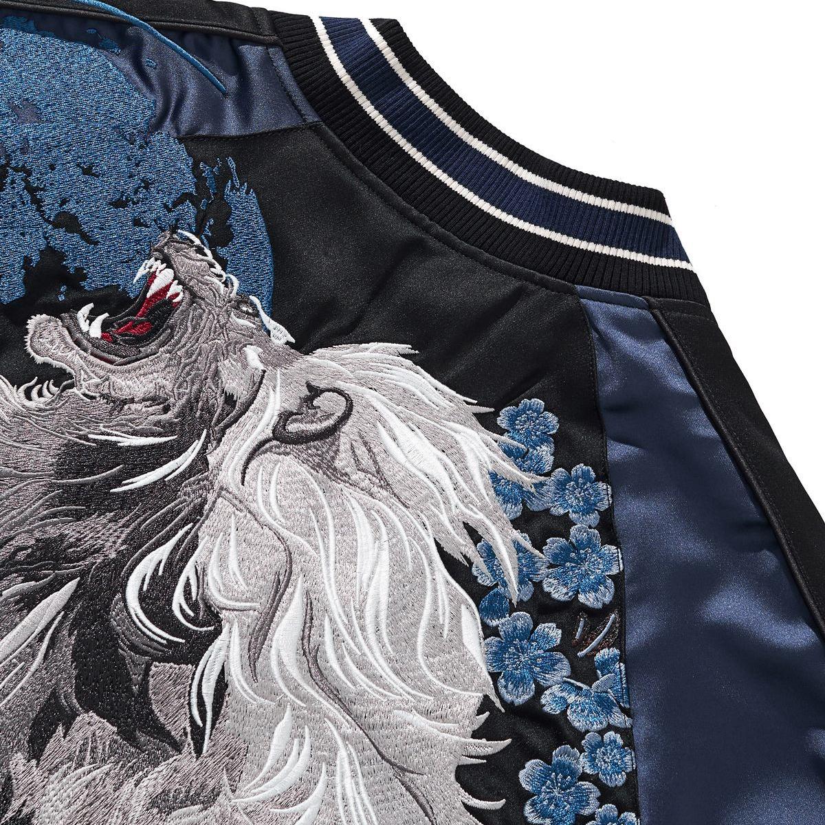 Close-up of ribbed collar and shoulder with moon and floral embroidery