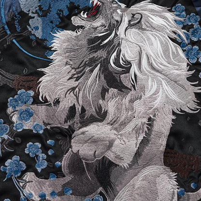 Back embroidery close-up showing the lion and clustered blossoms