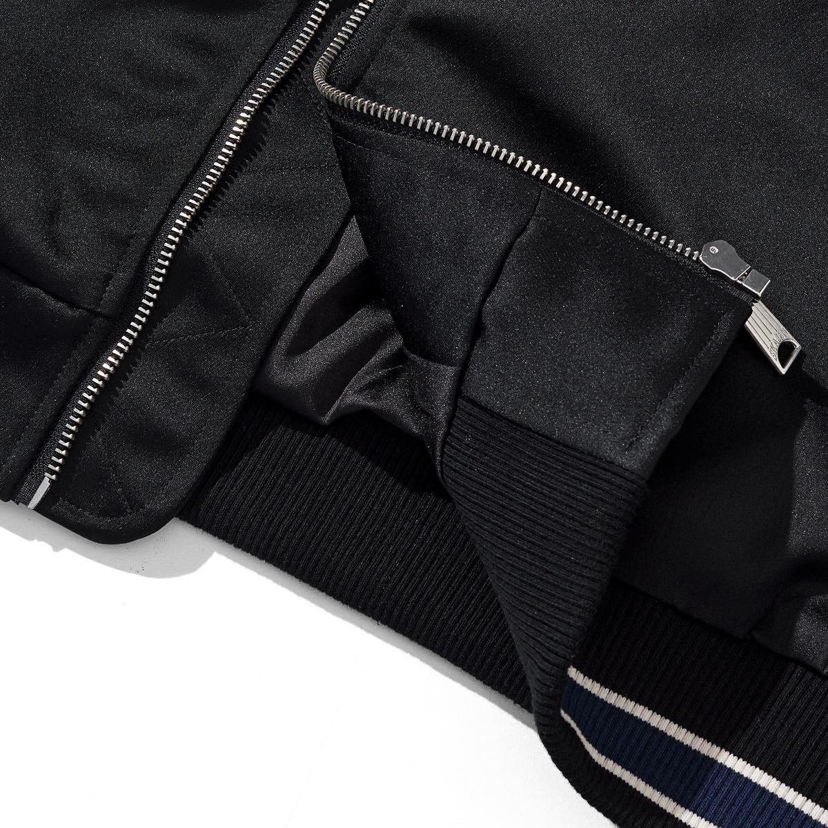 Hem detail with metal front zipper and rib knit waistband
