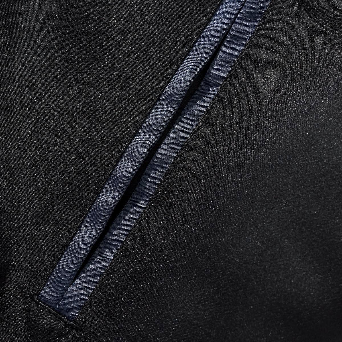 Slanted pocket with neat navy satin welt trim