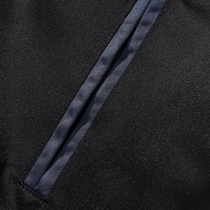 Slanted pocket with neat navy satin welt trim