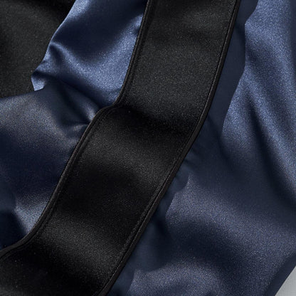 Satin sleeve detail with black top stripe and navy panel