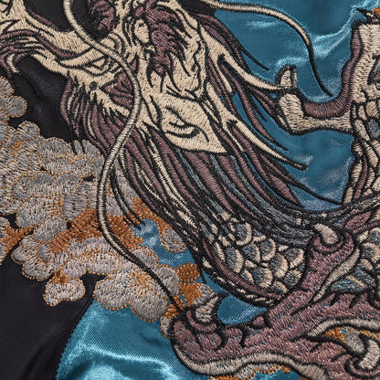 Macro photography showing the high-density silver thread texture of the dragon scales.