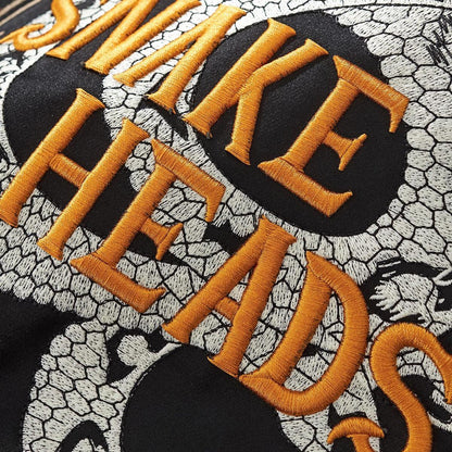 Close-up of raised satin lettering with dense stitches