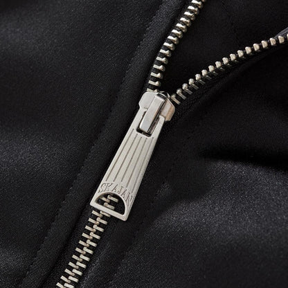 Metal zipper puller close-up with clean teeth