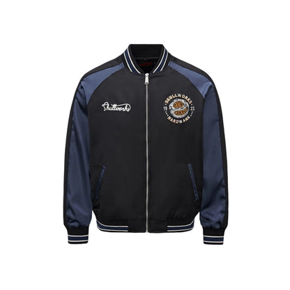Front view with Skullworks chest crest and raglan satin sleeves