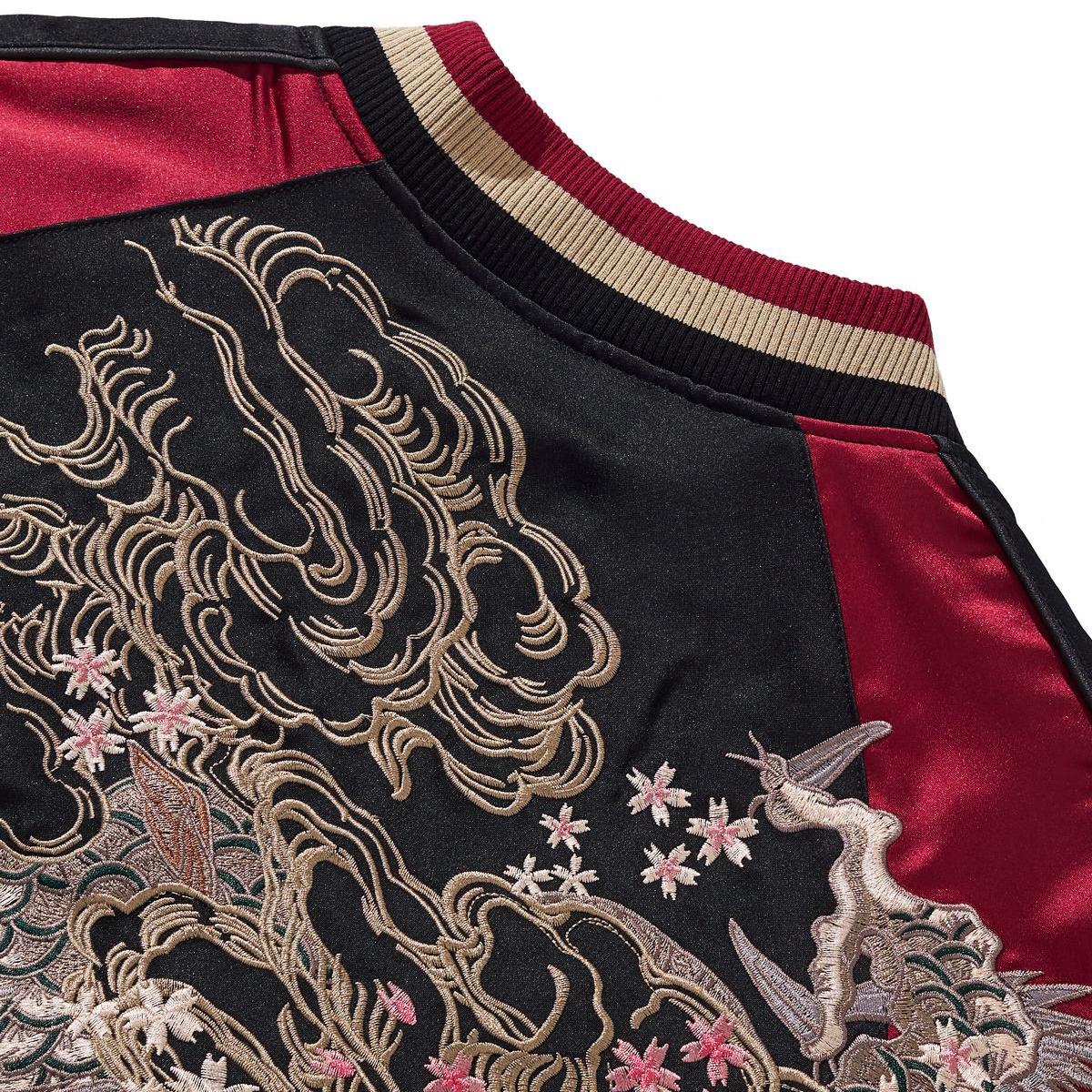 Back yoke embroidery detail with cloud curls and petals