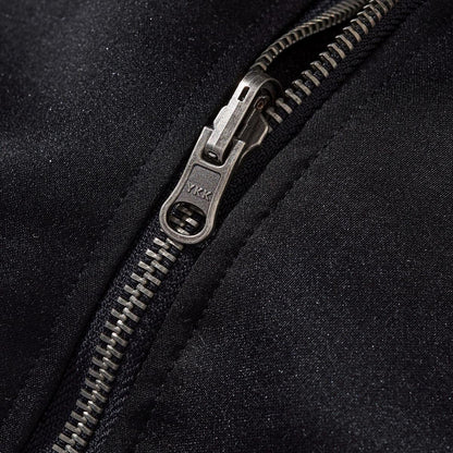 Metal YKK zipper close-up with fine teeth