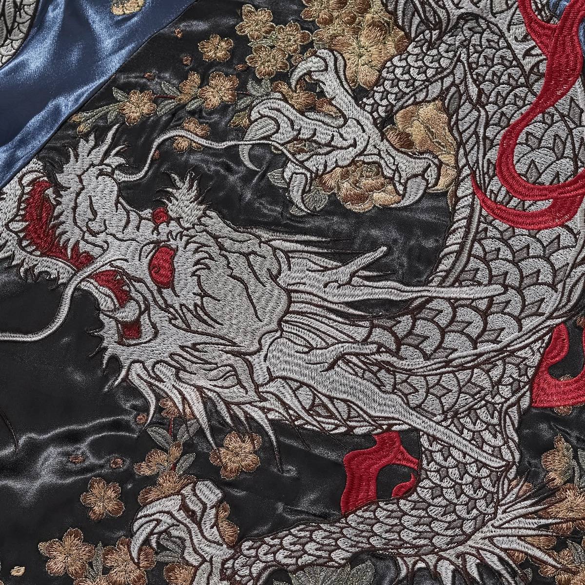 Macro view of main storm dragon back embroidery with peony storm on Storm Dragons & Peony sukajan jacket.