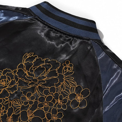 Close-up of navy collar and cascading peony outline embroidery on back of Storm Dragons & Peony sukajan.